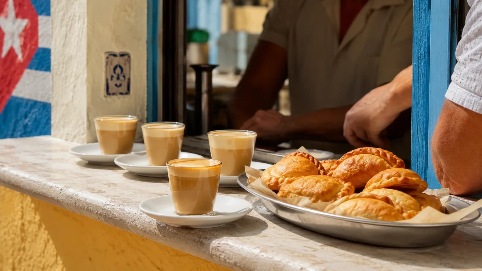 Cortaditos served with pastelitos at a Cuban cafe window