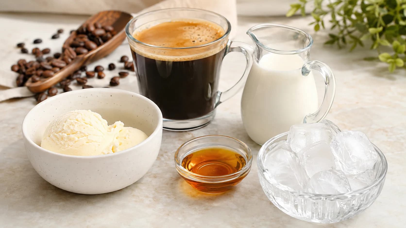 Frappe coffee ingredients with chilled coffee, milk, ice, syrup, and ice cream on a counter
