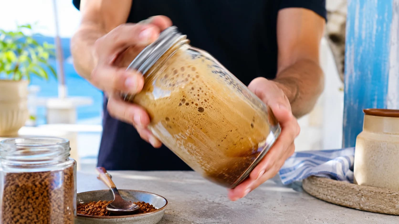 Greek frappé instant coffee being shaken into dense foam