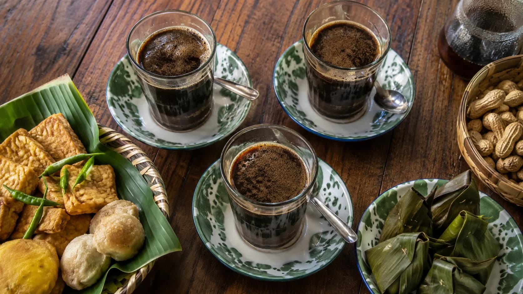 Kopi tubruk served in a glass after the coffee grounds settle at the bottom