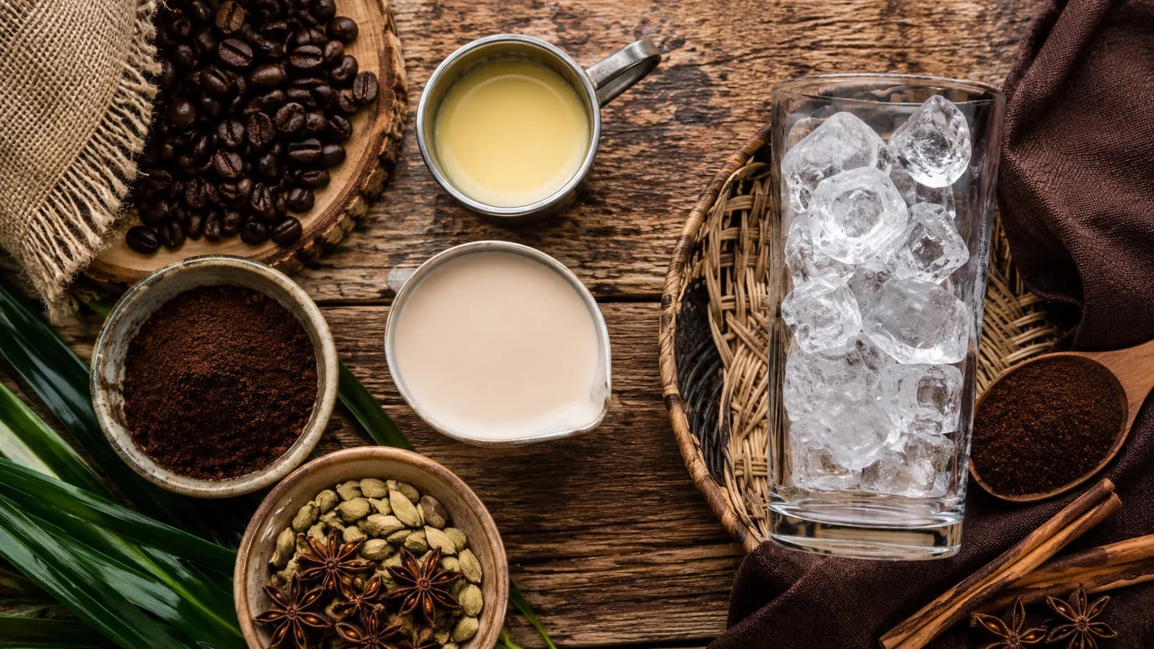 Thai iced coffee ingredients with dark coffee, roasted grains, condensed milk, and spices